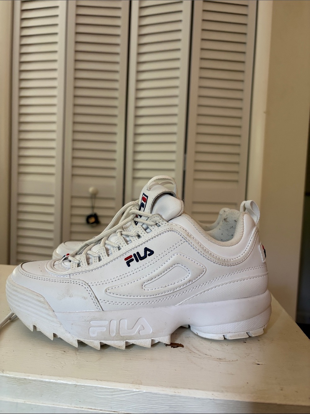 Fila White Chunky Platform Disruptor Sneaker with Navy & Red Logo
